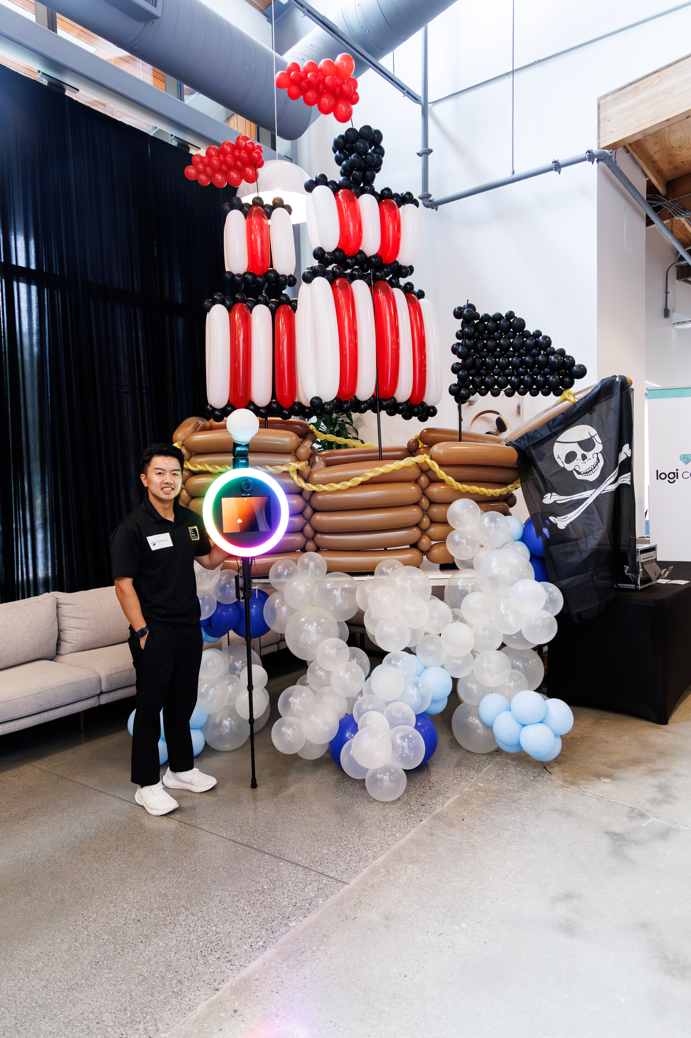 Balloon pirate ship decoration setup with a roaming photo booth to capture photos